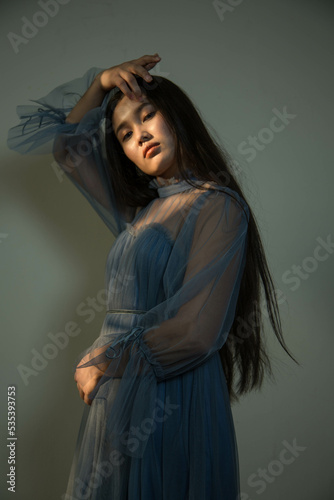 Wallpaper Mural Portrait of young East Asian woman in blue dress Torontodigital.ca