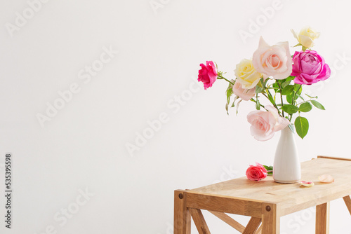 Wallpaper Mural pink and white roses in white ceramic vase on white background Torontodigital.ca