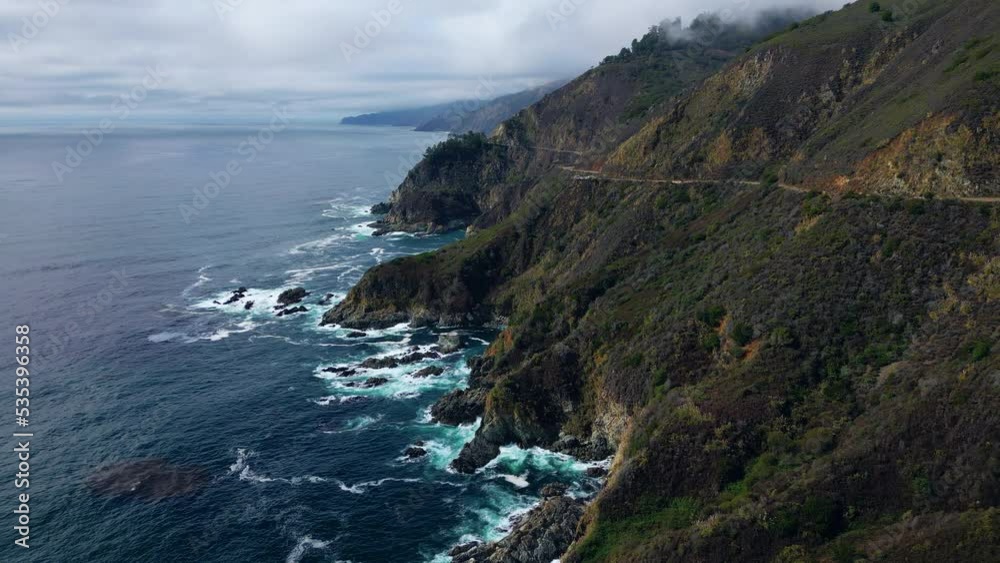 Natural Aerial drone flying over Big Sur California coast beach. Ocean sunrise clouds sky sun sunny waves crashing. Travel view scene peak weather wave. High quality 4k footage. Natural Aerial drone flying over Big Sur California coast beach. Ocean sunrise clouds sky sun sunny waves crashing. Travel view scene peak weather wave. High quality 4k footage.