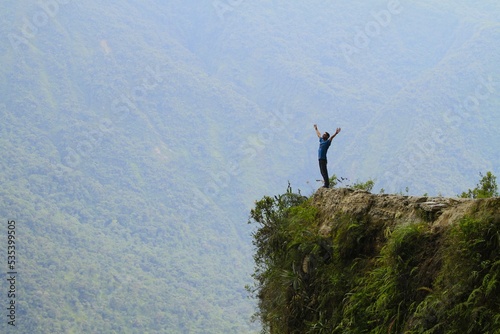 Young man on the road of death, Yungas - Bolivia photo