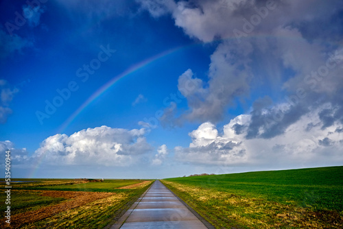 Regenbogen über der Deichanlage von Spieka-Neufeld an der Wurster Nordseeküste. photo