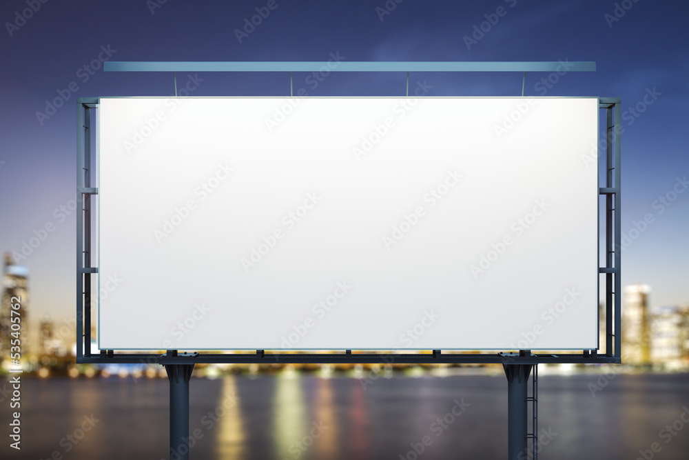 Blank white billboard on city buildings background at night, front view. Mockup, advertising concept