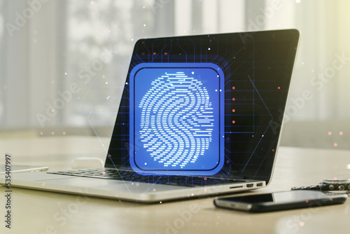 Abstract creative fingerprint concept on modern laptop background. Multiexposure
