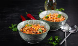 Chili con carne in bowl - traditional dish of mexican cuisine.