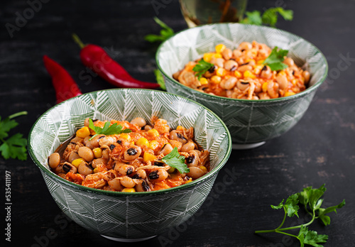 Chili con carne in bowl - traditional dish of mexican cuisine.