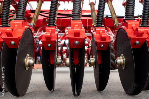 Precision seeder discs close-up for industrial design. Modern Modified Agricultural Seeder. photo