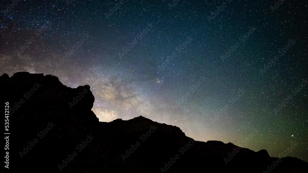 Astro motion time lapse - Milky Way appear over mountains, starry night sky Astro motion time lapse - Milky Way appear over mountains, starry night sky