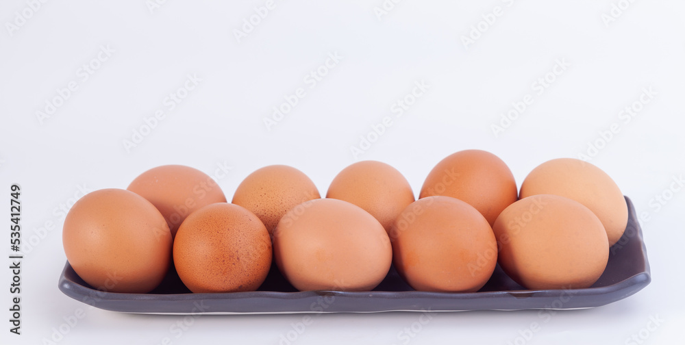 chicken eggs lies in a japaness ceramic saucer on white background. chicken eggs lies in a japaness ceramic saucer on white background.
