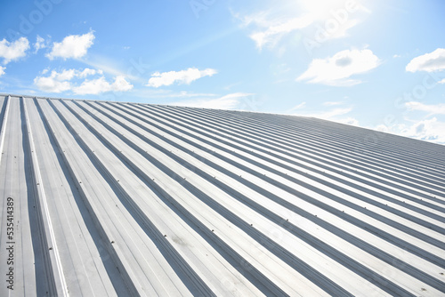 metal sheet roofing on commercial construction with blue sky