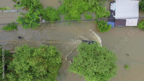 High-angle view of the Great Flood, Meng District, Thailand, on October 3, 2022, is a photograph from real flooding. With a slight color adjustment