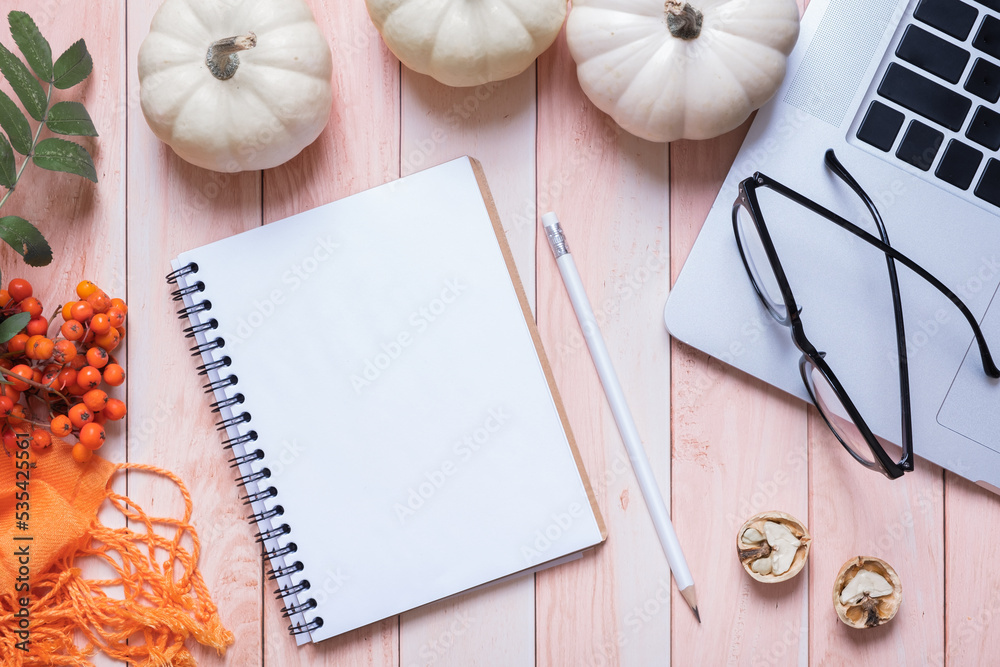 Blank sheet of paper and autumn cozy decor top view. Copy space for autumn text