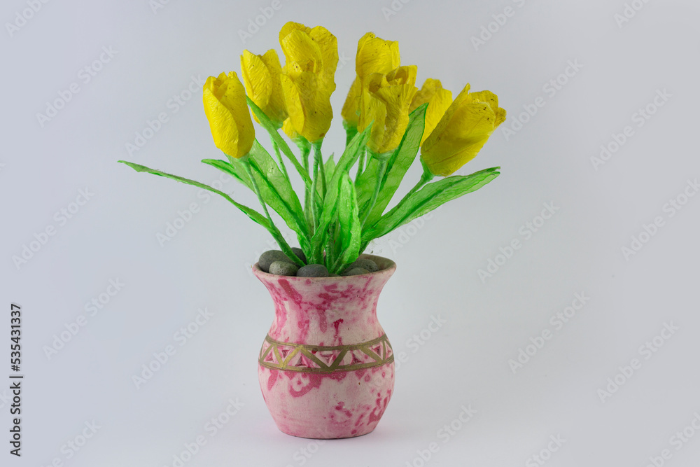 Indonesian home made imitation yellow flower made from papper and plastic at vase