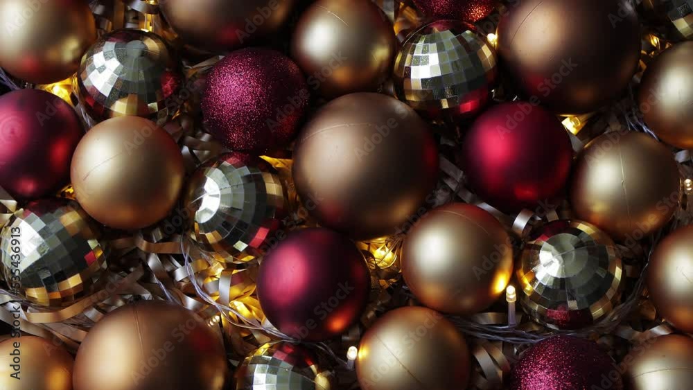 christmas and new year background - close up of golden and red Christmas baubles with led lights christmas and new year background - close up of golden and red Christmas baubles with led lights