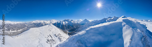 Panorama of winter landscape with snowy mountains