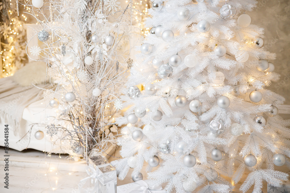 The interior of the house is decorated with a Christmas tree in anticipation of the holiday. A large bright room is decorated with decorations. New Year. Christmas decorations The interior of the house is decorated with a Christmas tree in anticipation of the holiday. A large bright room is decorated with decorations. New Year. Christmas decorations