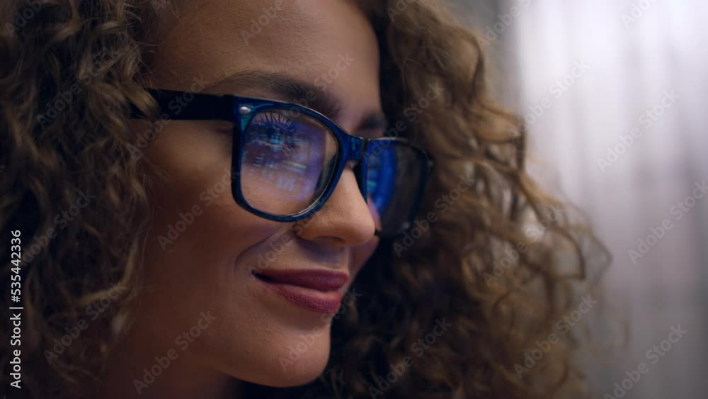 Close up of young woman working on computer in office. Close up of young woman working on computer in office.