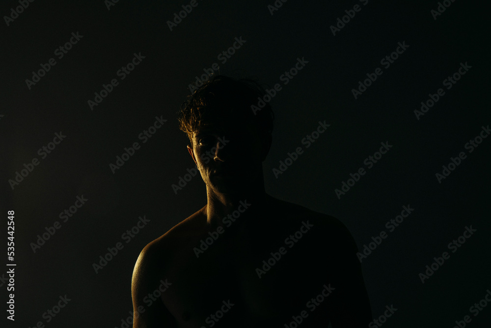 silhouette of a person in the darkness. Man shadow. Dark. 