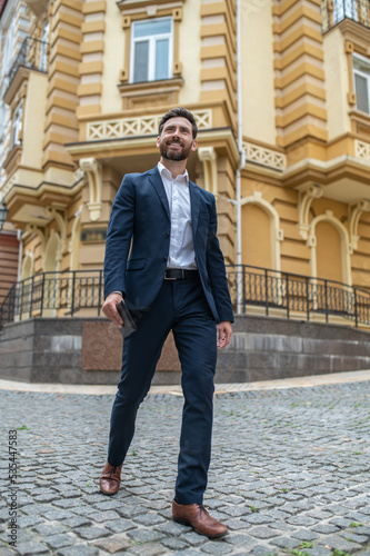 Good-looking elegant man walking in the street © zinkevych