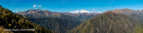 Early fall panorama of the Panoramica Zegna mountains. Is a touristic viewpoint, located in Piedmont Region (Northern Italy), Biella Province. on background: the Rosa Massif (Italian Alps).