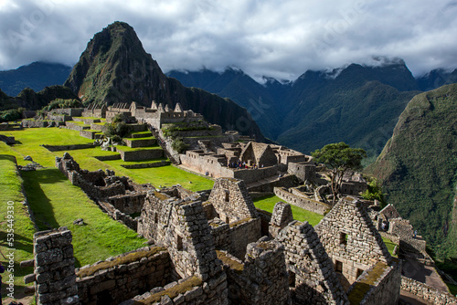 The ancient ruins of buildings at Machu Picchu which is a 15th-century Inca site located 2,430m above sea level in the Sacred Valley of the Incas in Peru. 