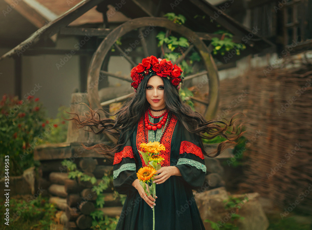 Close-up portrait Ukrainian happy girl looks at camera. Authentic woman smiling face. National ethnic vintage costume black dress stylish vyshyvanka. Wreath crown on head red flowers roses, poppies Close-up portrait Ukrainian happy girl looks at camera. Authentic woman smiling face. National ethnic vintage costume black dress stylish vyshyvanka. Wreath crown on head red flowers roses, poppies