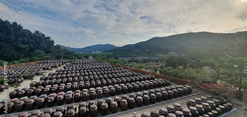 Aerial drone shot of hundreds of jars outdoors in Baeil-gil, Jeondong-myeon, South Korea photo