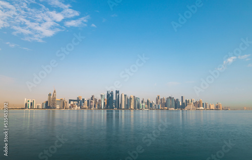 Long exposure sunrise panorama photo of Abu Dhabi skyline.
