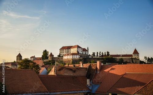 Facade of Ptuj Castle in Slovenia against a blue sky photo