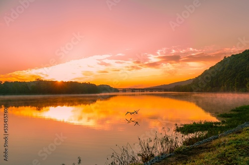 Dramatic sunset over a waterscape with reflection photo