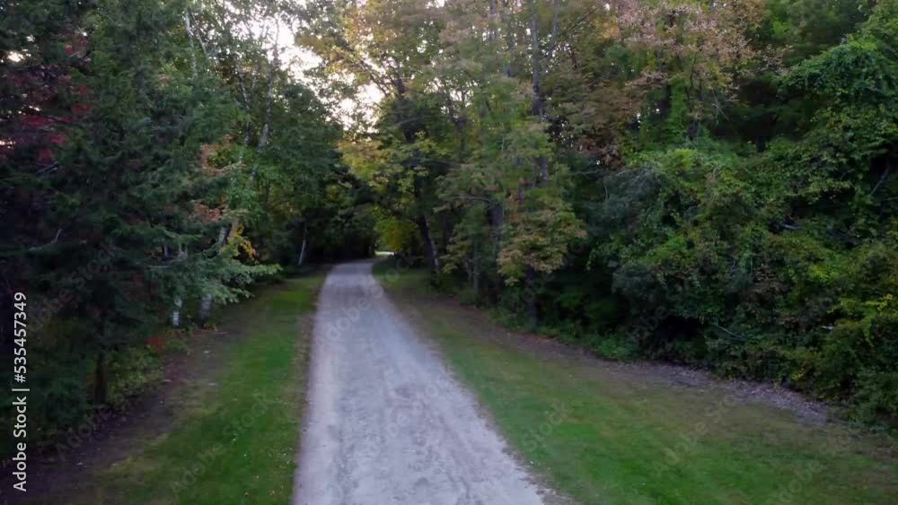 A upwards crane shot of a dirt road in fall. A upwards crane shot of a dirt road in fall.