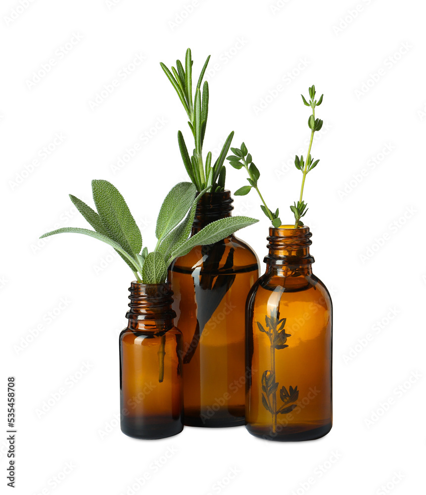 Bottle of essential oil and fresh herbs isolated on white Bottle of essential oil and fresh herbs isolated on white