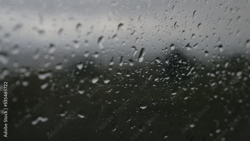 Raindrops running down the window of a car, in New Zealand Raindrops running down the window of a car, in New Zealand