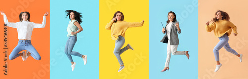 Group of happy jumping women on color background