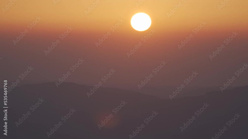 Misty mountain sunrise timelapse through wet humid air Misty mountain sunrise timelapse through wet humid air
