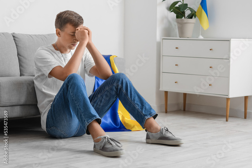 Young man with flag of Ukra...