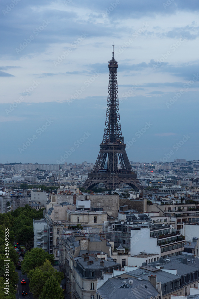 Close-up view of the eiffel tower in Paris at night. High quality photo