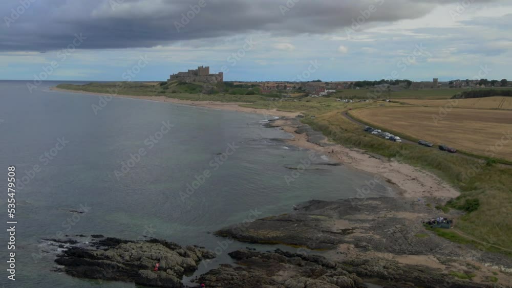Aerial flyover above Bamburgh castle in norther England Aerial flyover above Bamburgh castle in norther England