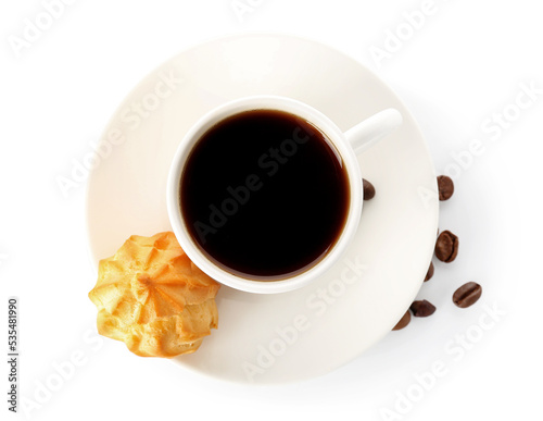 Cup of coffee and tasty eclair on white background