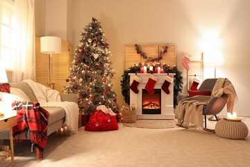 Interior of living room with Santa bag, fireplace and Christmas tree