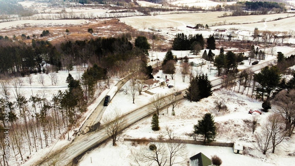 Naklejka premium Bird's eye view of the cityscape of Hillsdale, New York under a cloudy sky in winter
