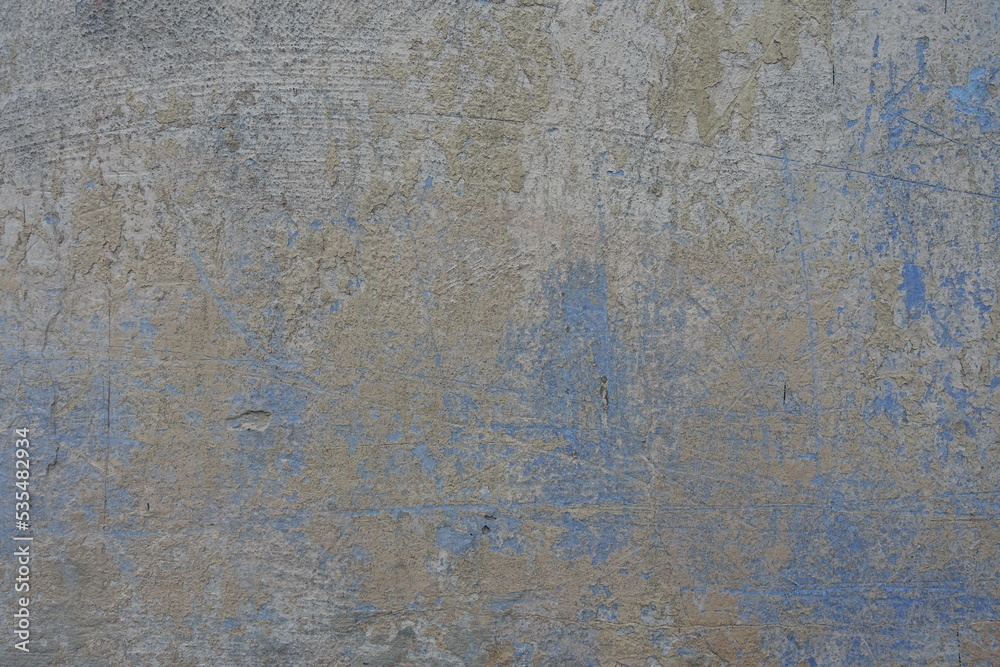 Background - beige and blue old, faded and scratched painted wall