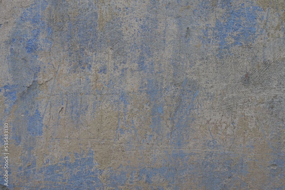 Grey and blue old, faded and scratched painted wall texture