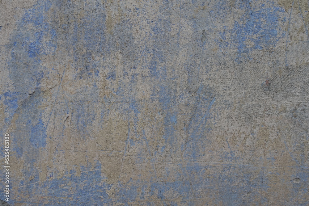 Grey and blue old, faded and scratched painted wall texture Grey and blue old, faded and scratched painted wall texture