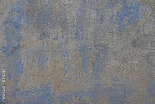 Grey and blue old, faded and scratched painted wall texture