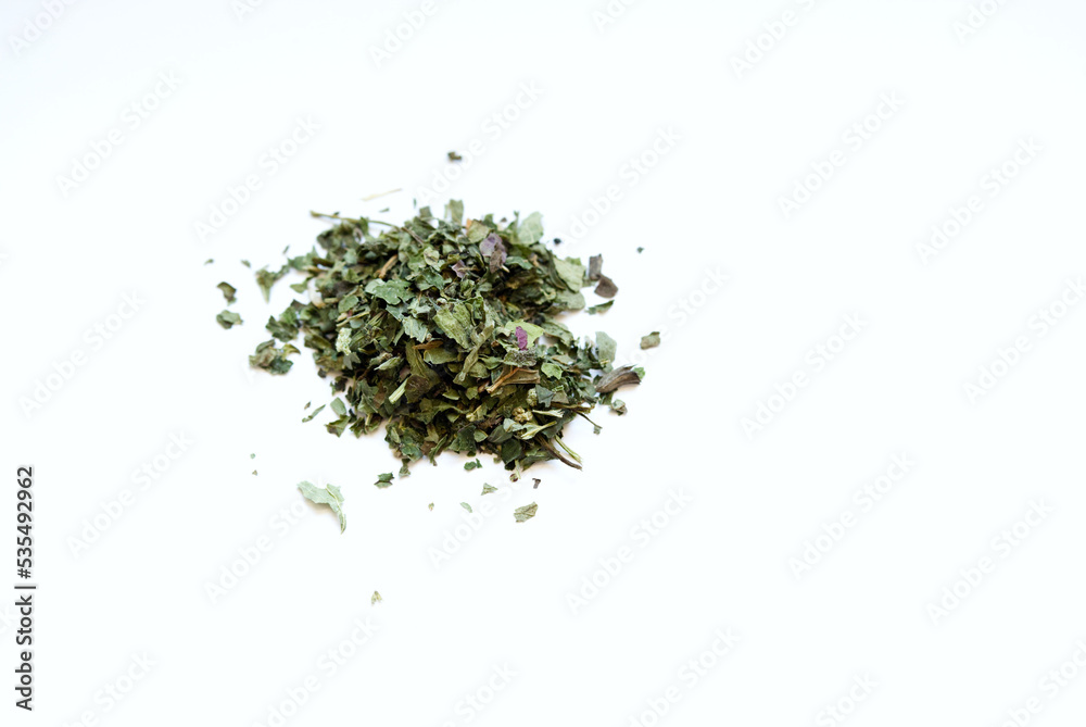 pile of dried melissa herb for dry herb vaporizer isoated against white background pile of dried melissa herb for dry herb vaporizer isoated against white background