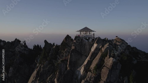 Aerial footage of the sunset over Mount Pilchuck Lookout Tower, Washington State photo