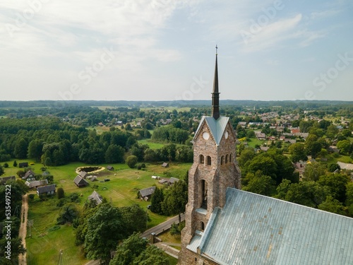 Aerial view of a historic old stone church in the rural green areas of Salakas, Lithuania photo