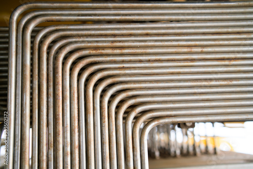Small stainless steel pipes arranged in a row for hydraulic oil control.