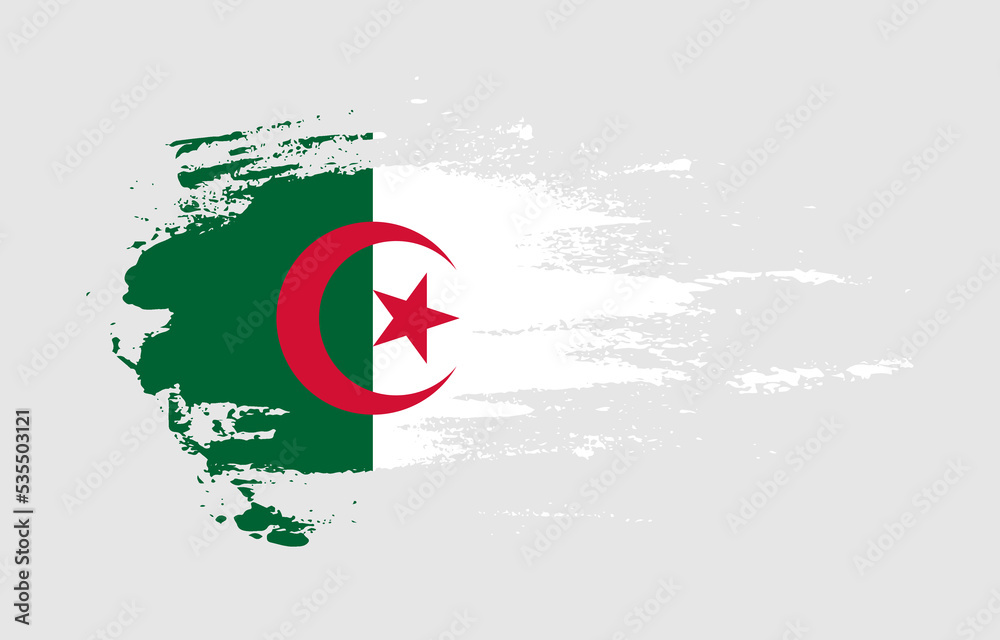 Grunge brush stroke flag of Algeria with painted brush splatter effect on solid background Grunge brush stroke flag of Algeria with painted brush splatter effect on solid background
