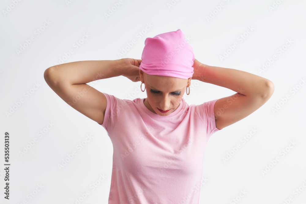a woman suffering from cancer wearing a pink scarf a woman suffering from cancer wearing a pink scarf